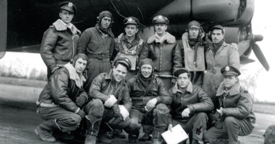 The ground crew of the 100th Bomb Group poses in front of a B-17 aircraft at the Kearney Air Force  Base around 1943. Photo courtesy of Chandler Lynch, 74, a Kearney resident and historian, and the  Buffalo County Historical Society. Lynch’s father, with whom he shares a name, kneels second  from the right in the bottom row.