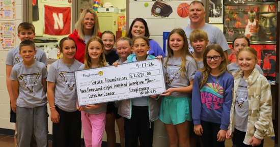 Engleman Student Character Council, Mrs. Nelson, and Mr. Caspar smile with Sarah Koch presenting her with the donation check for GCF